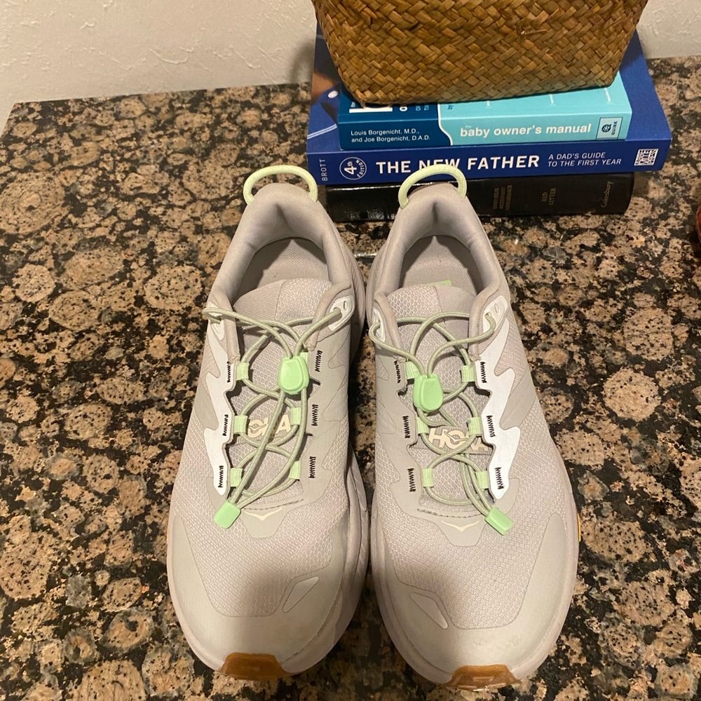 Hoka transport tennis shoes